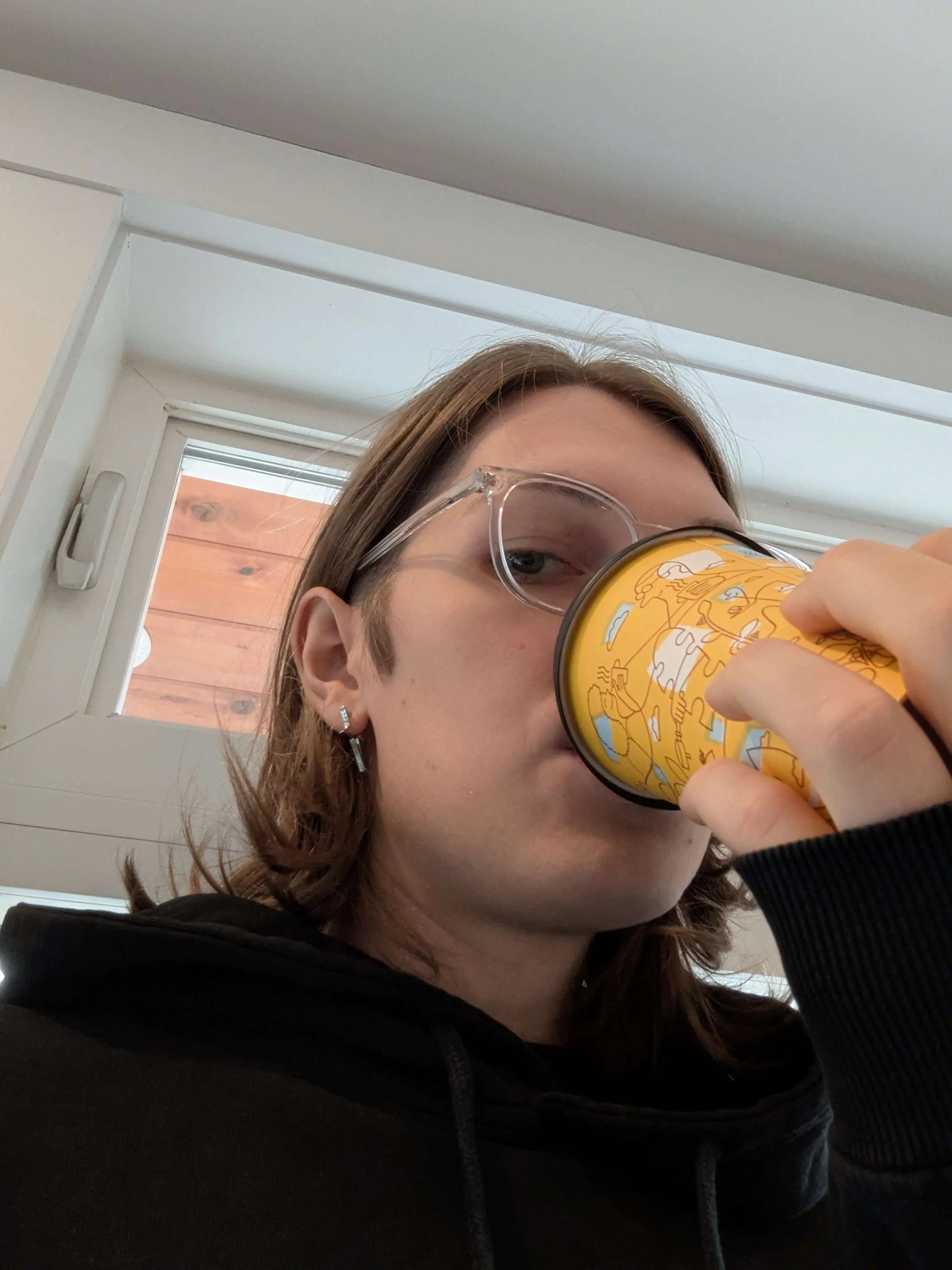 Gen sipping pear lavender matcha latte from moonrise bakery